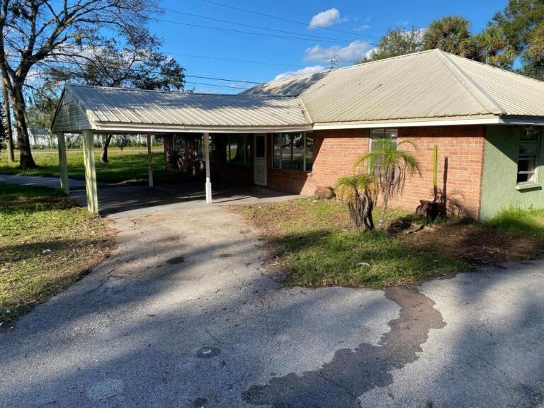 Driveway cleared after hurricane debris removal and junk hauling service.