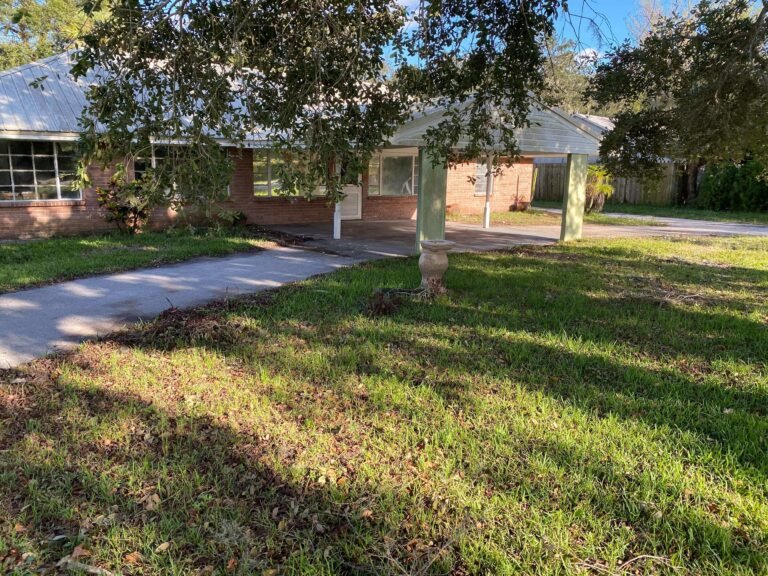 Clean yard and driveway after full hurricane cleanup and property cleanout.