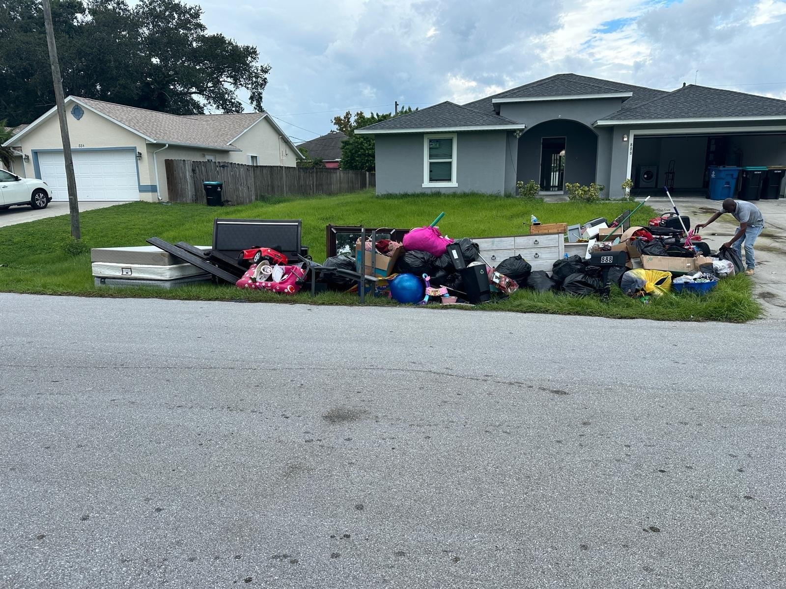 curbside junk removal during Tenant Cleanouts in Brevard County with debris and furniture removed from rental property
