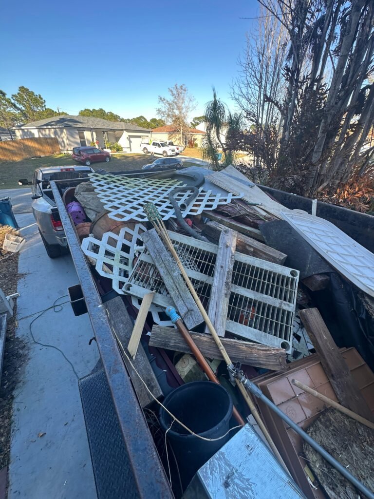 furniture and bulky household debris prepared for junk removal in Palm Bay FL
