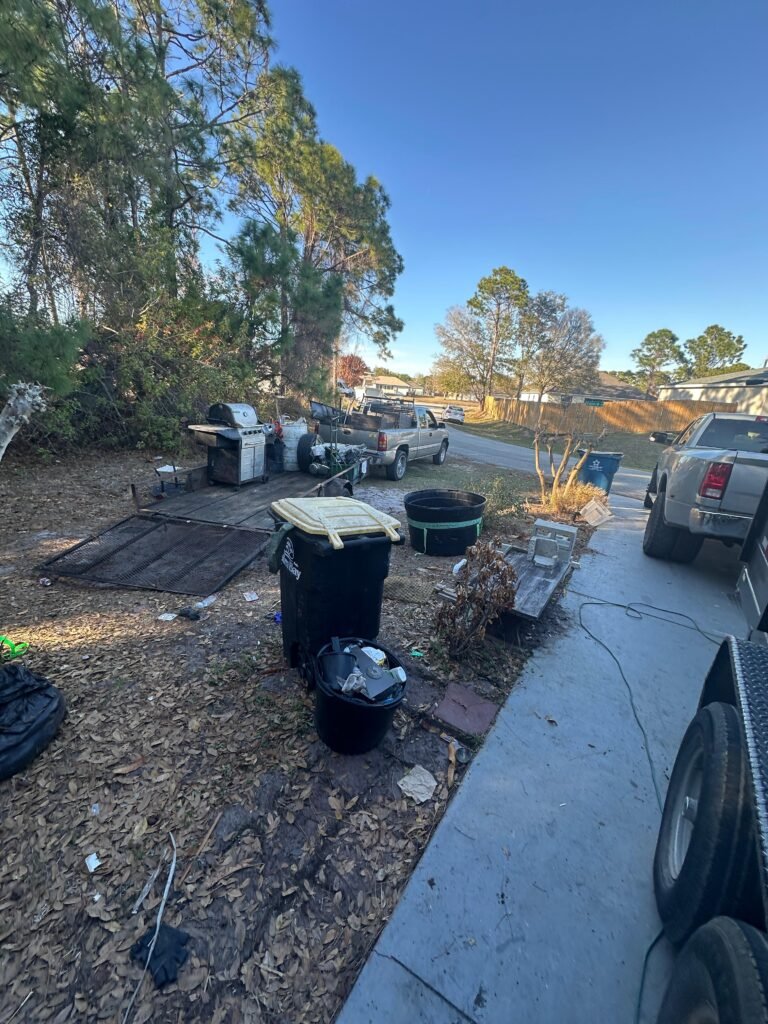 large pile of household junk and debris collected during a Brevard County cleanout