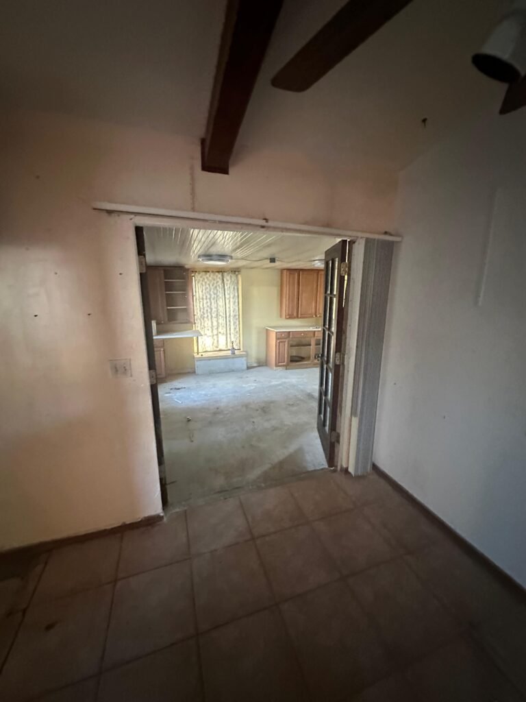 interior hallway before whole house cleanout and junk removal in Palm Bay FL