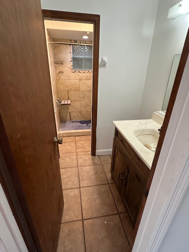 Renovated bathroom with tile shower after Palm Bay junk removal and demolition project