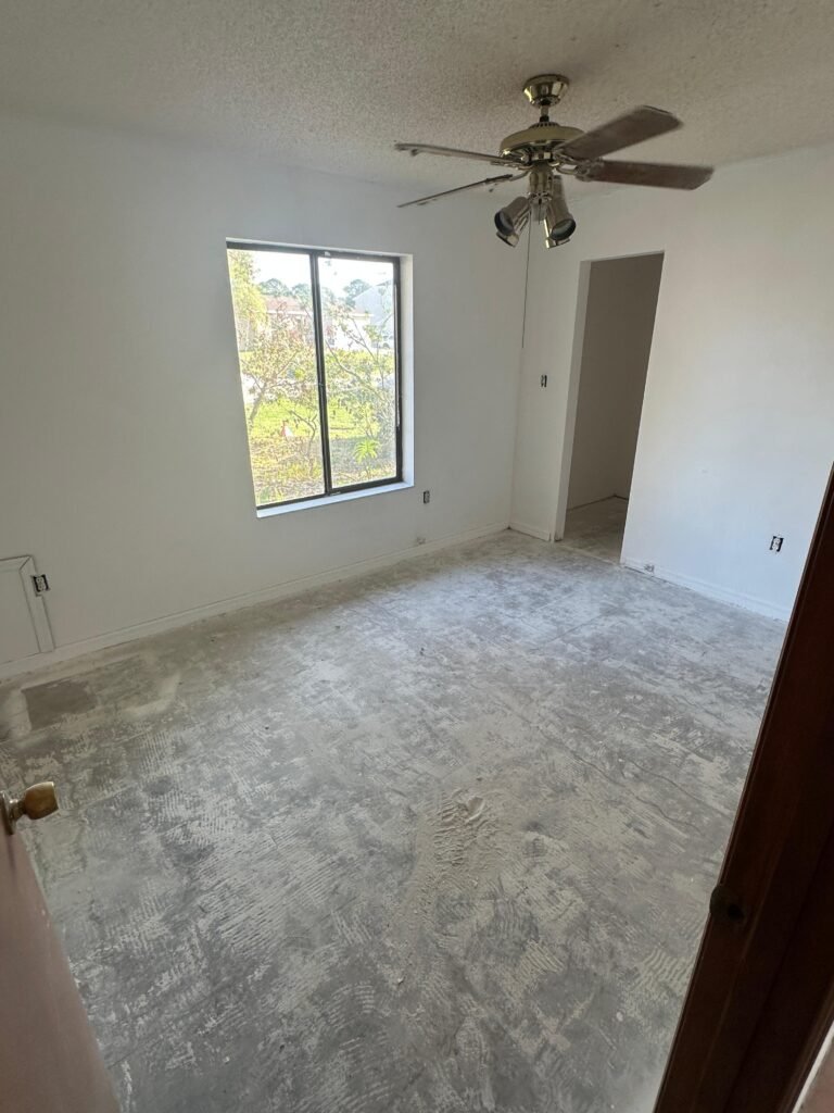 Palm Bay FL tenant eviction cleanout bedroom with patched walls and fresh paint
