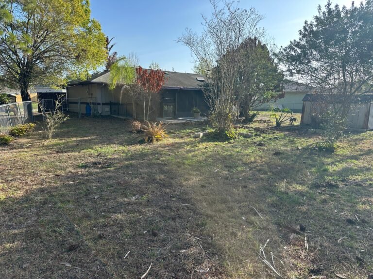 Cleaned and landscaped backyard after Palm Bay demolition and junk removal project