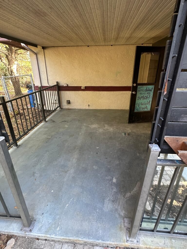 Pressure washed patio after Palm Bay FL eviction cleanout and demolition project
