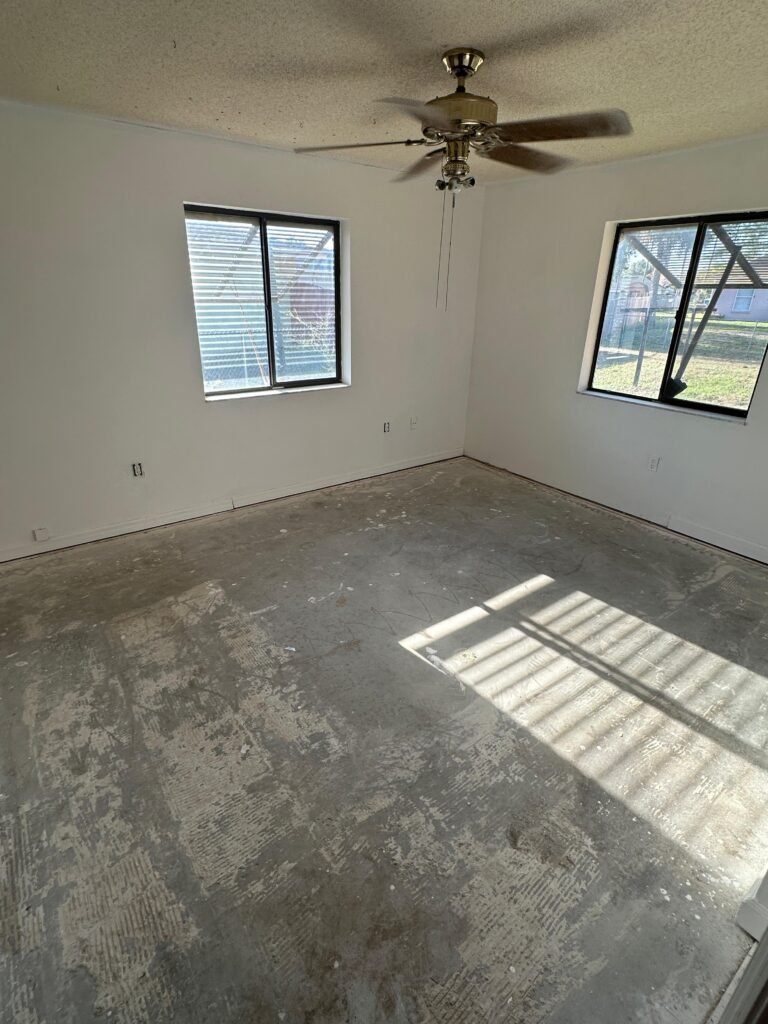 Bright bedroom with repaired walls after Palm Bay junk removal and demolition