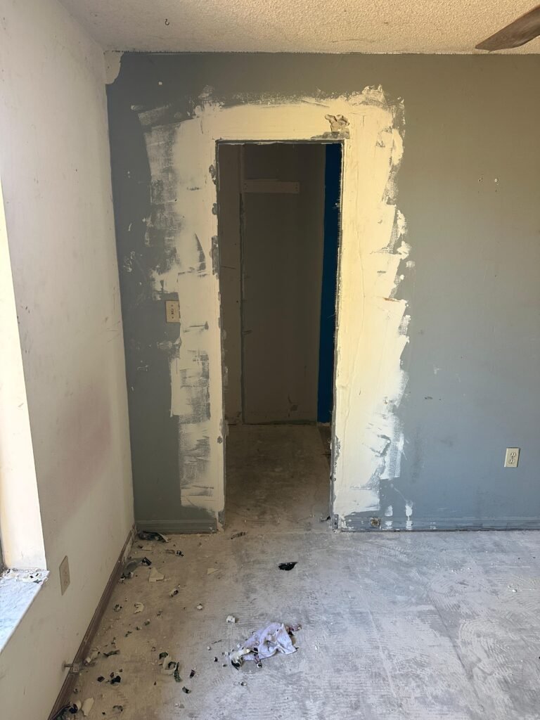 Repaired doorway framing during Palm Bay demolition and interior rebuild project