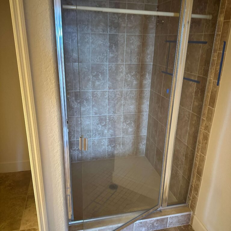 Bathroom demolition showing removed wall finishes and exposed framing