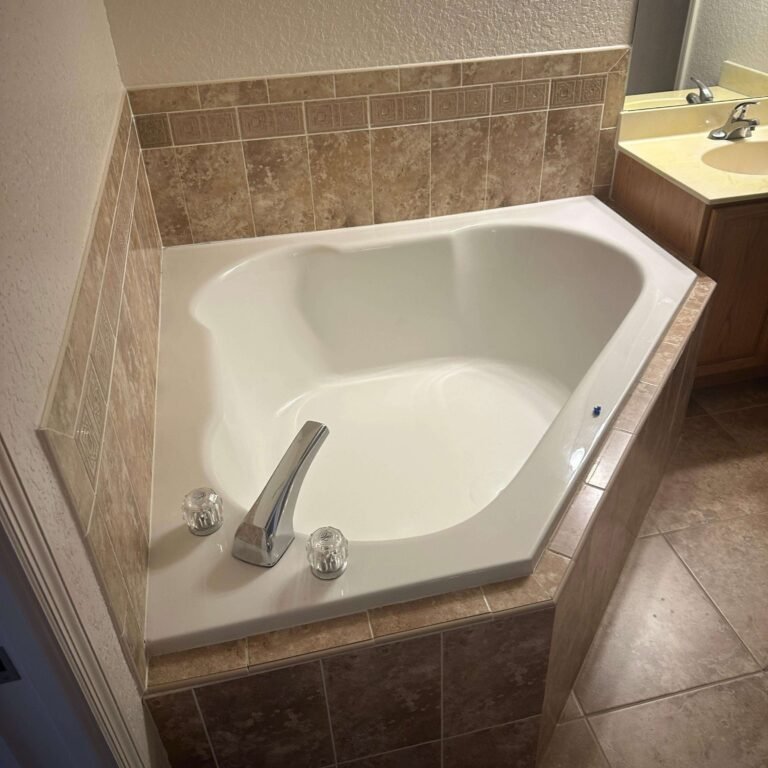 Existing bathtub and tile before condo bathroom remodeling in Cocoa Beach