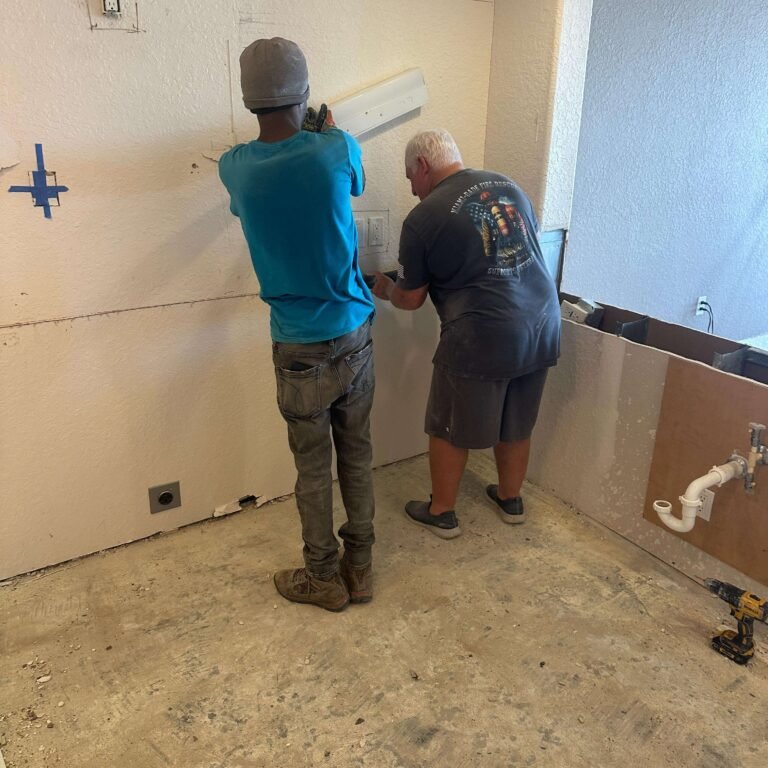 Kitchen with flooring removed during a condo remodeling project