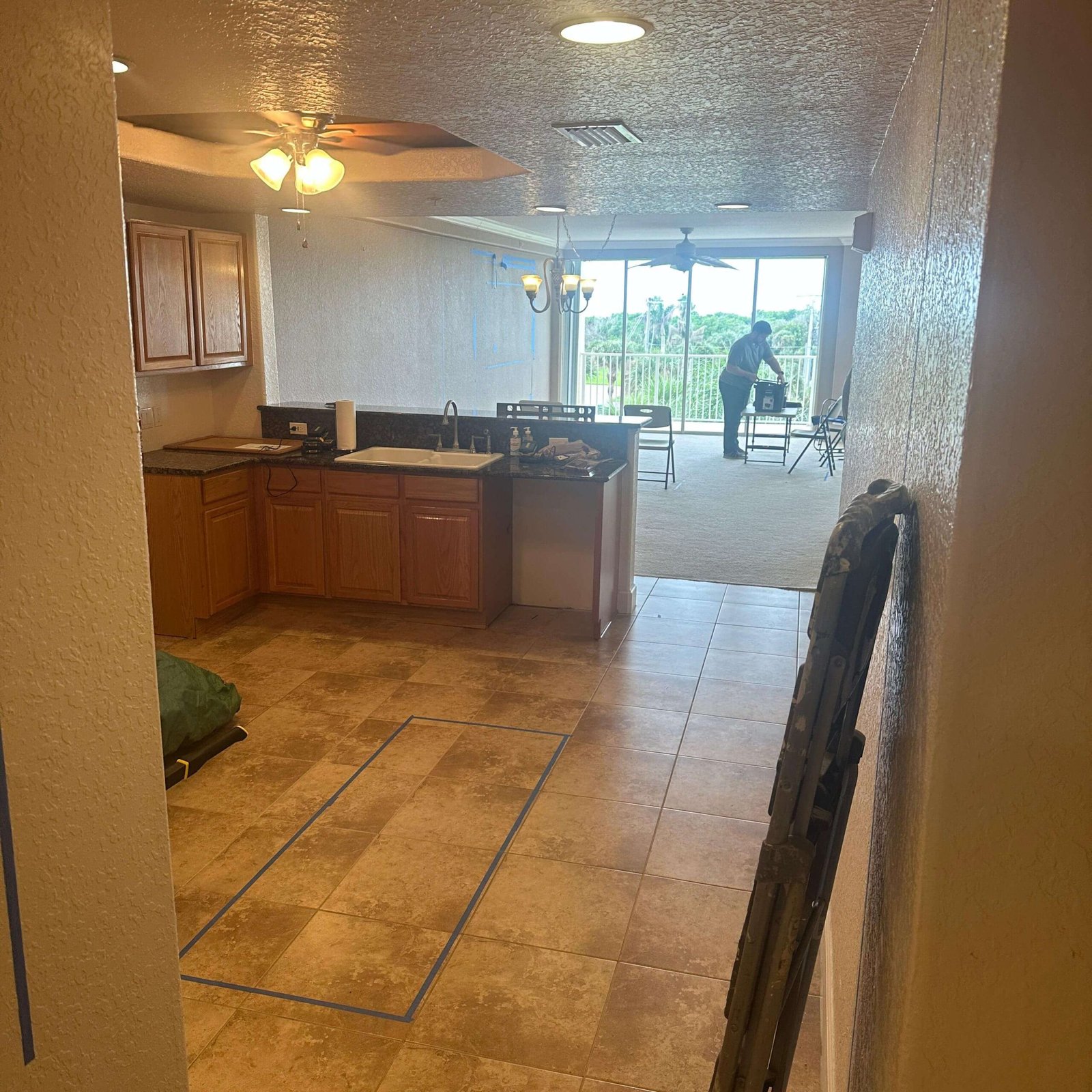 Condo kitchen and living area prepared for remodeling in Cocoa Beach