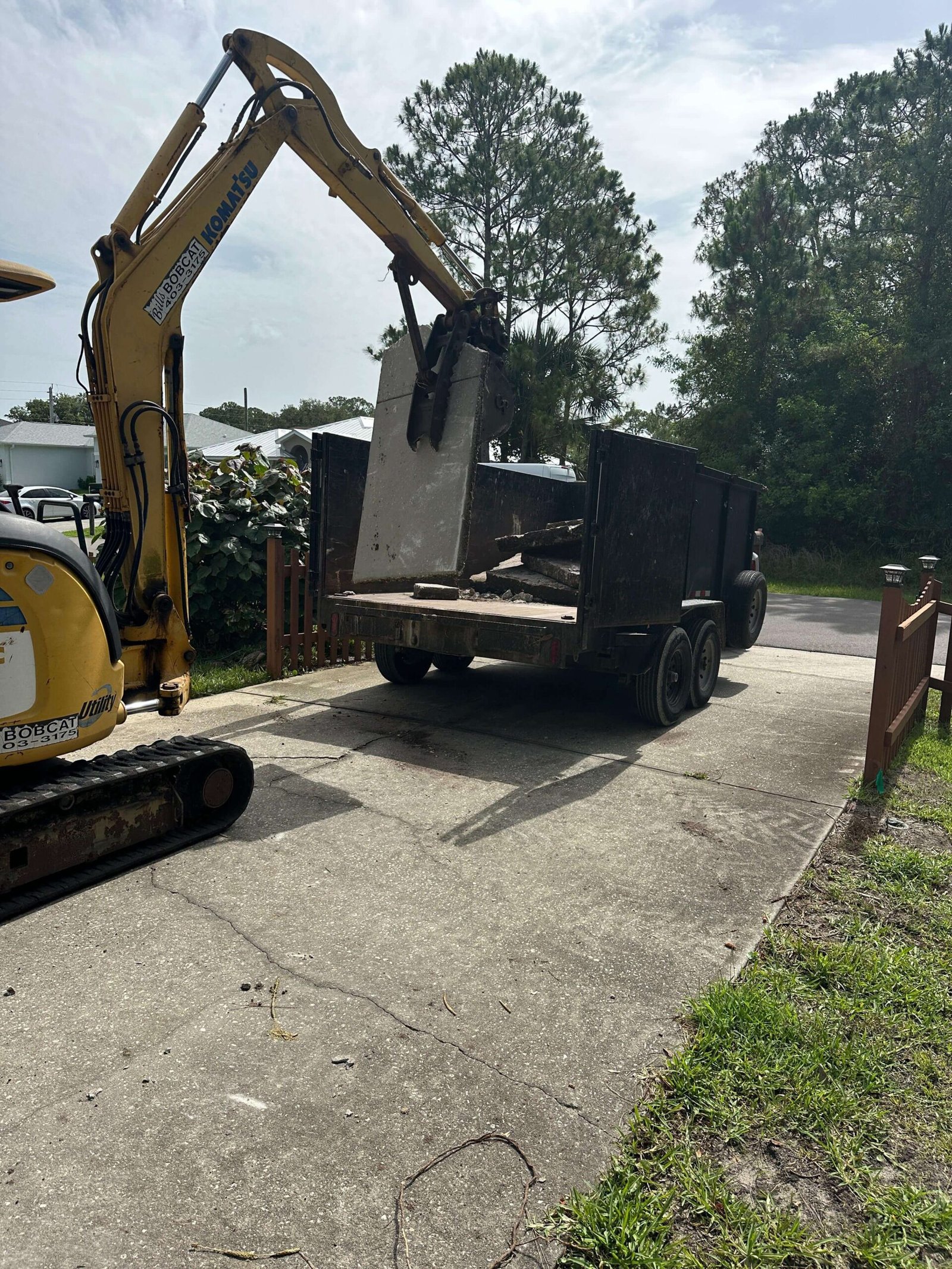 Concrete driveway demolition and debris removal project in Palm Bay, FL